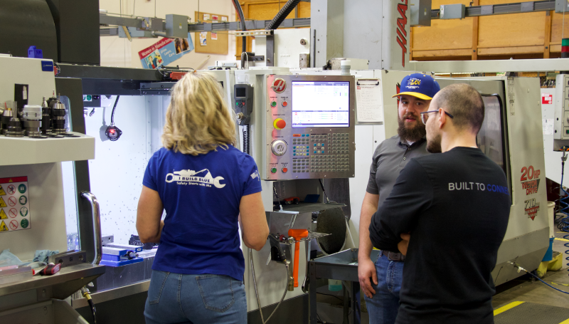 a CNC instructor shows off machinery at an event