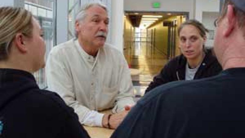 image of Roger Ebbage talking with students