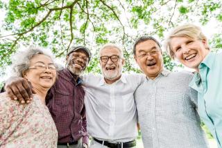 Five Senior Citizens smiling.