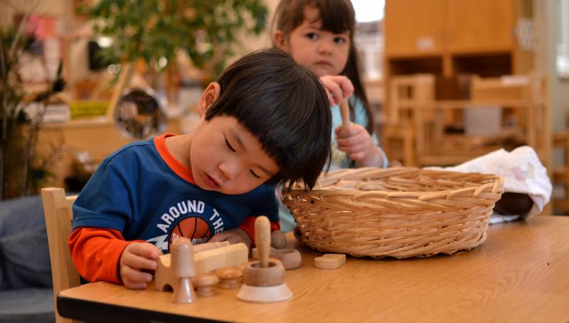 Child playing with building blocks