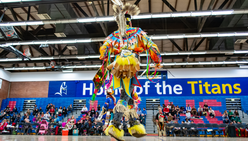 a pow wow dancer in the LCC gym