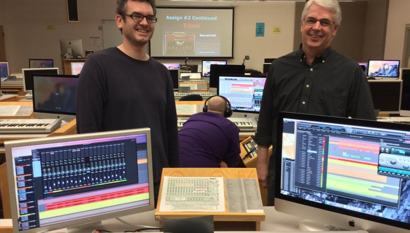 music tech instructors standing by keyboard and computer equipment