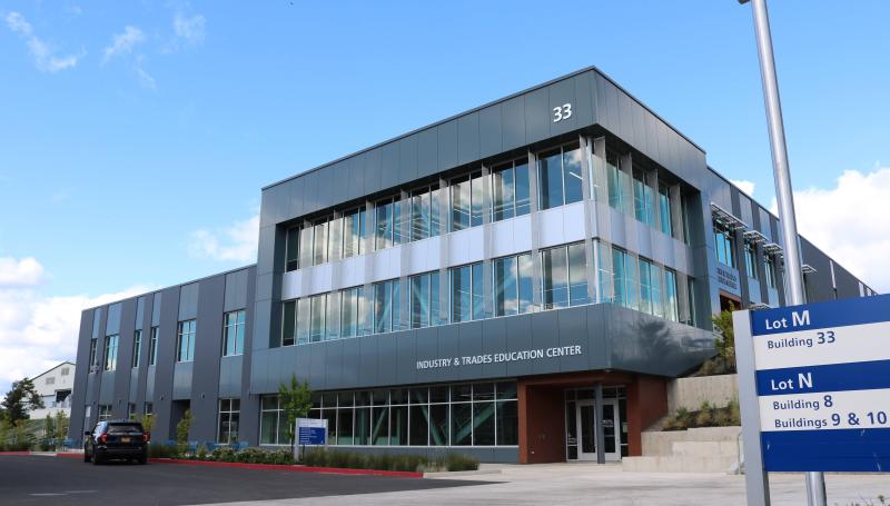ITEC building exterior; very wide Southeast view with campus sign
