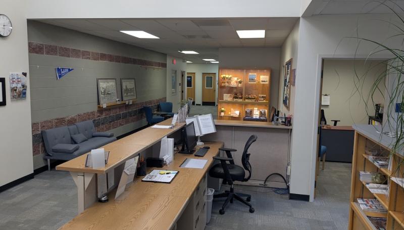 The front desk at the Cottage Grove Center, a bright space with Lane decorations
