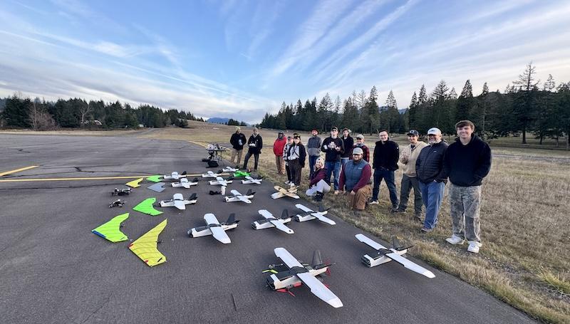 drone students posing with their drones at the rural Oakridge airport