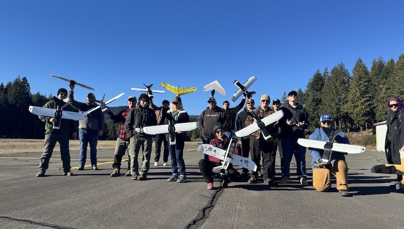 drone students posing with their drones at the rural Oakridge airport