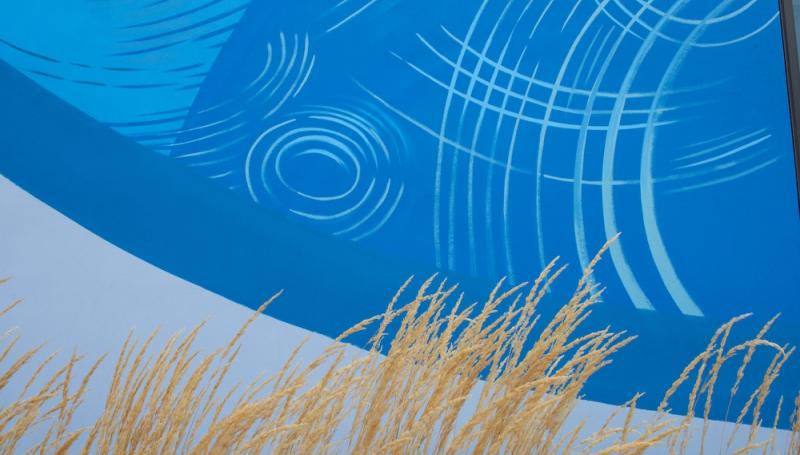 a close up of the mural on Bldg 32 showing a ripples in water