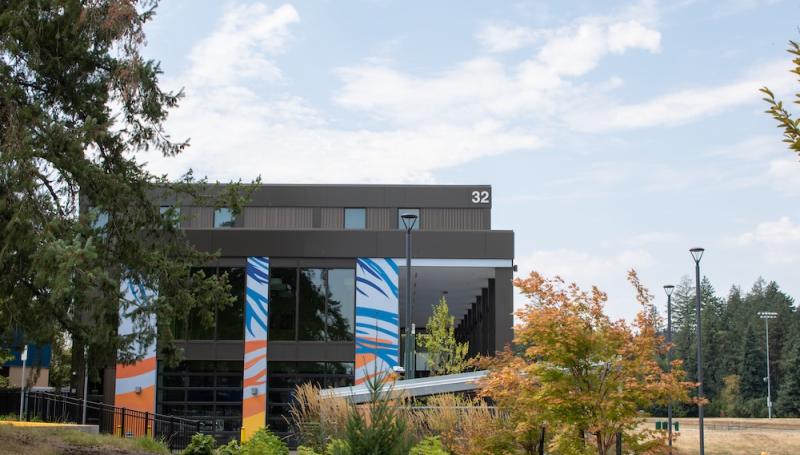Bldg 32 framed by trees as seen from the the performing arts building