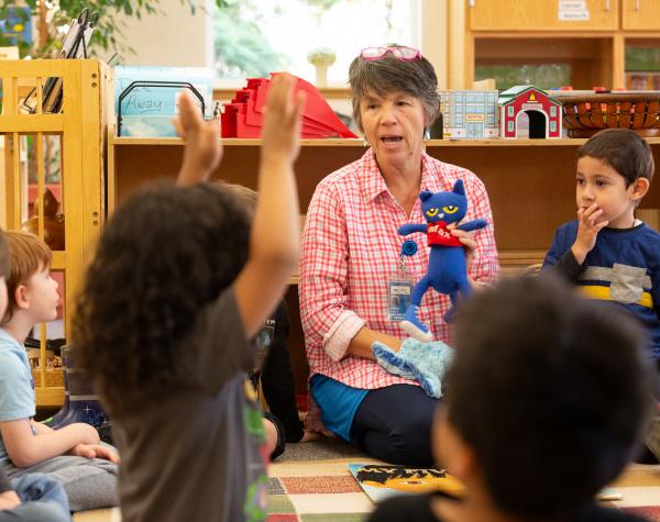 Childcare provider with a stuffed animal