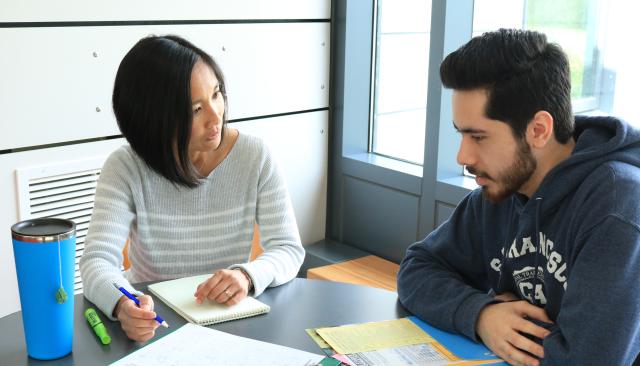 Advisor talking to student