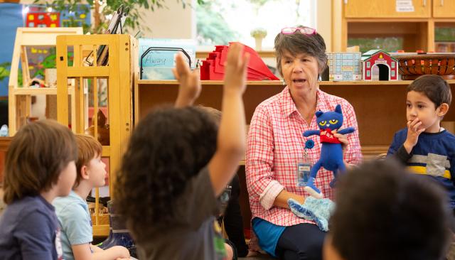 Childcare provider with a stuffed animal