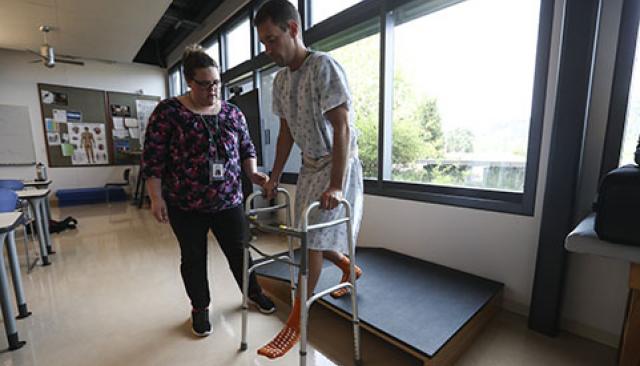 Physical Therapy Assistant program student with patient in Oregon