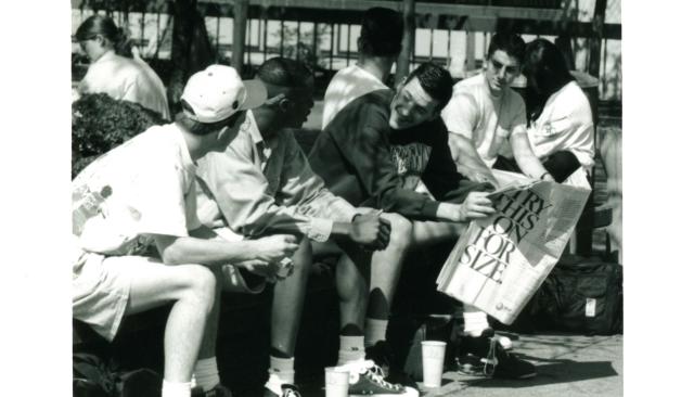 1990 photo of students with flashy sneakers hanging out on the quad 
