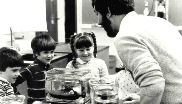 delighted children watching an LCC science instructor show off a live sea anemone in the 1990s