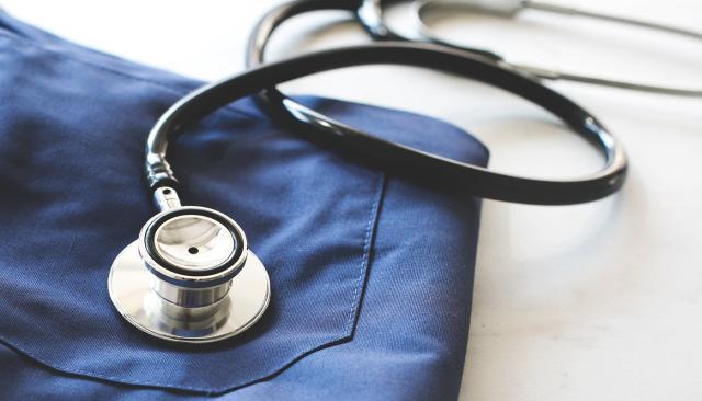 certified nursing assistant scrubs and stethoscope