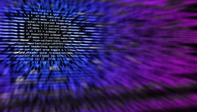 computer code on a screen with an artful blue and purple filter