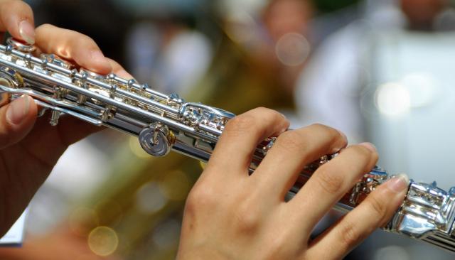 close-up of a Music-flute player