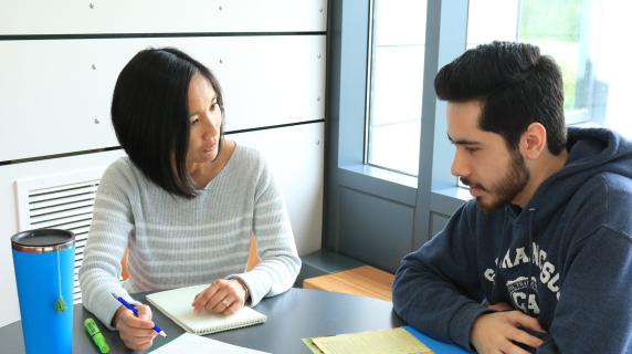 Advisor talking to student