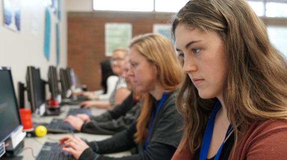Oregon students taking tests for their online college class