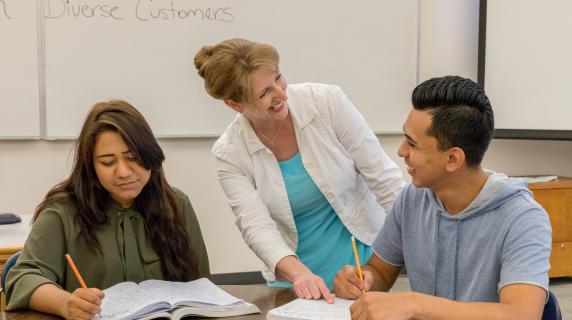 students getting help from a tutor