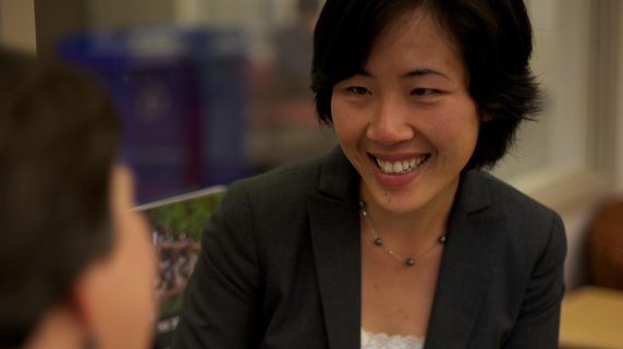 An LCC advisor smiles as she helps a student register for classes