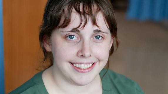 A female student in scrubs
