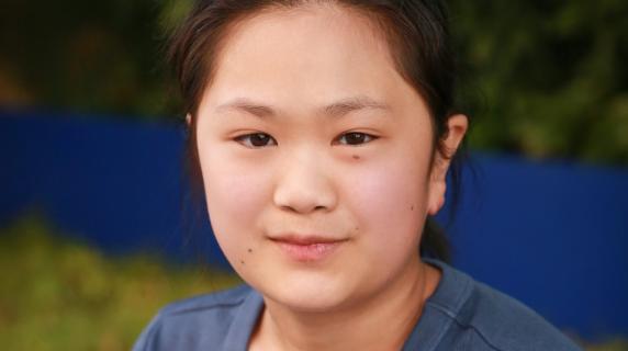 A woman in a blue shirt