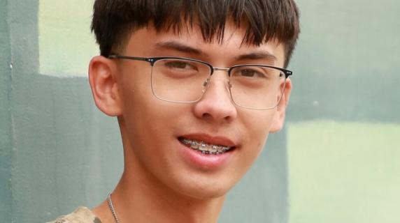 A man wearing glasses and a t-shirt