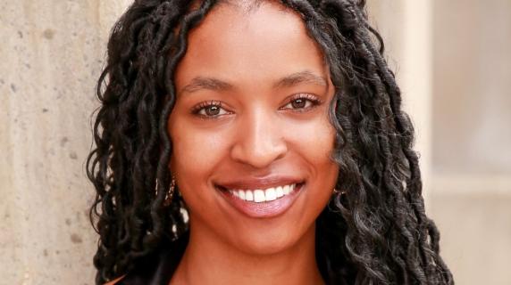 A woman with curly black hair