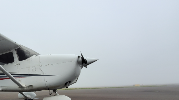 A Lane plane in the fog on our tarmac