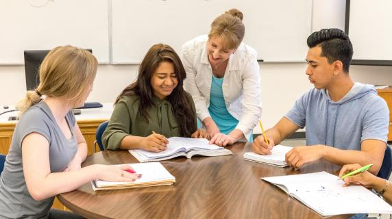 an instructor teaching business students about diverse communication