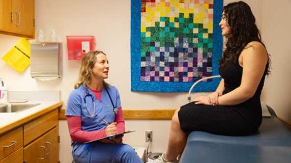 health clinic staff talking to student patient