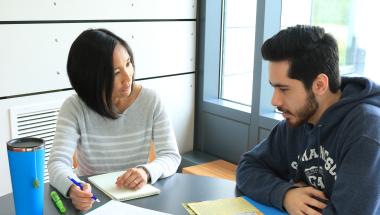Advisor talking to student