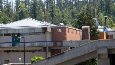 exterior shot of Building 15 with forest in background