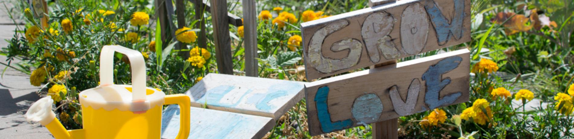 Garden sign and watering can