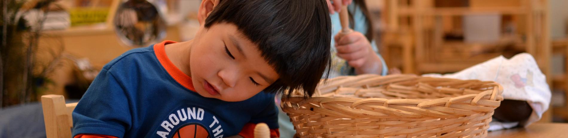 Child playing with wood building blocks