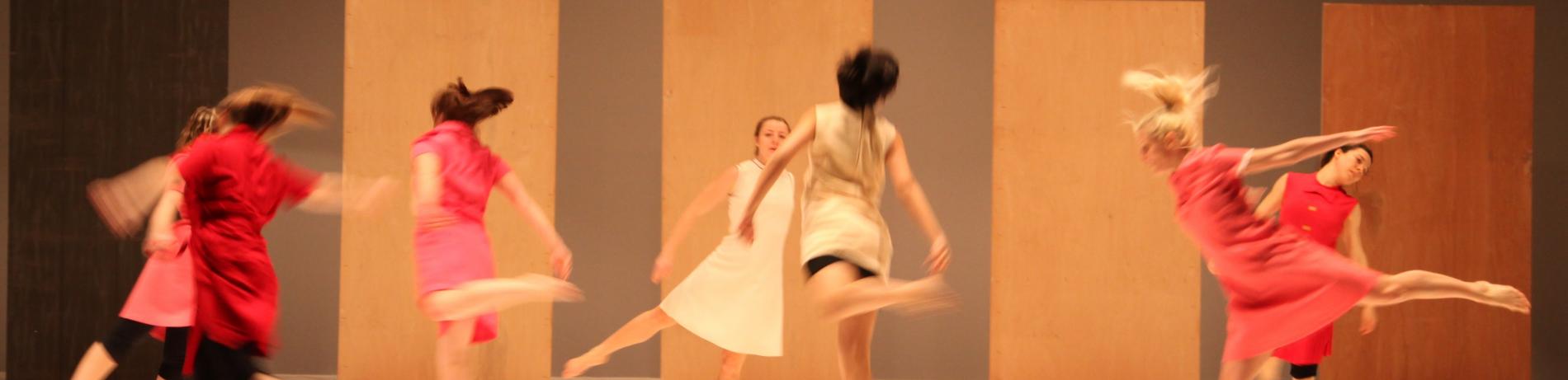 College student dancers dancing in a circle