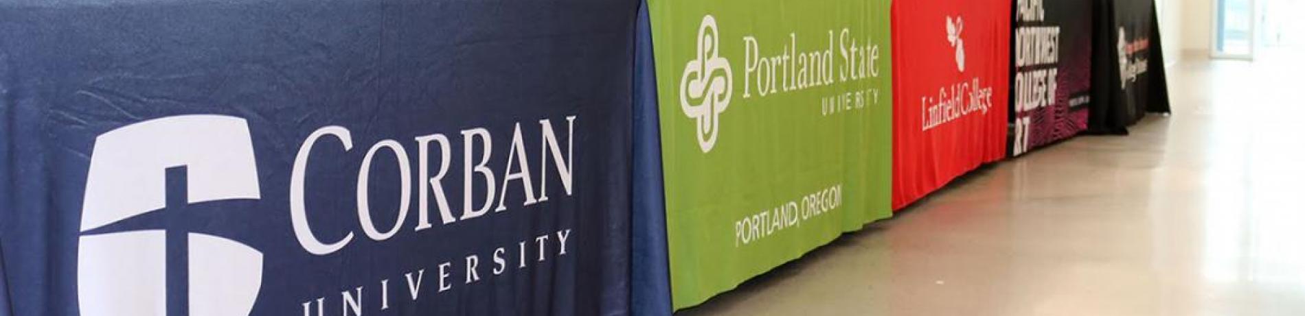 photo of colleges tables at transfer day event