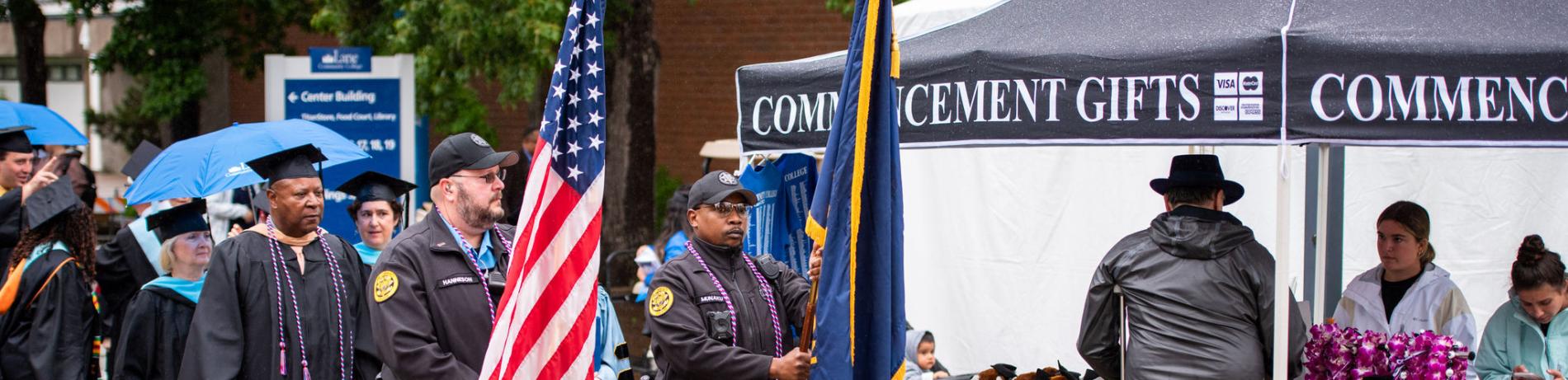 2022 Commencement-Public Safety carrying flags