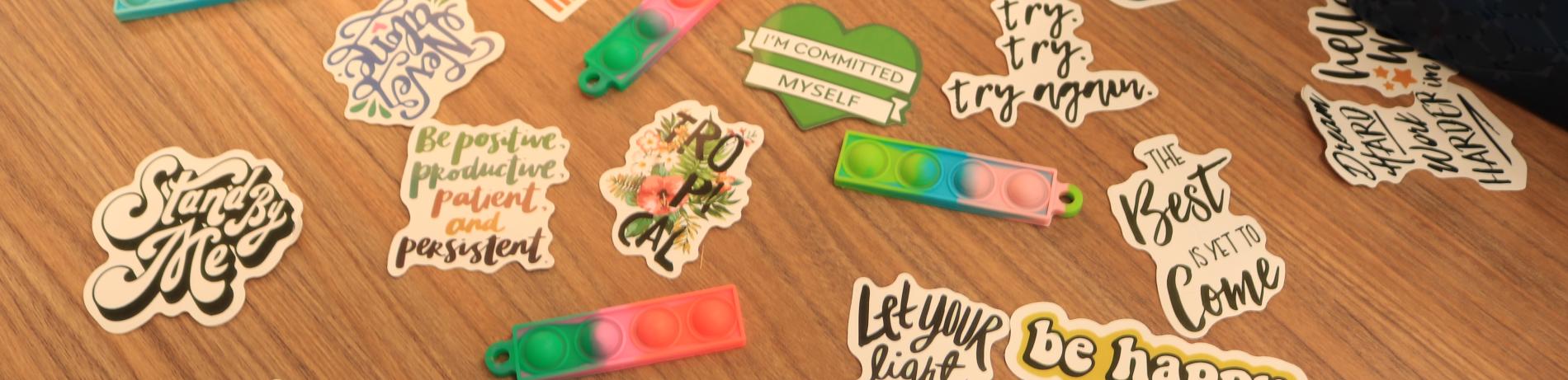 close up of stickers with affirmations on a table