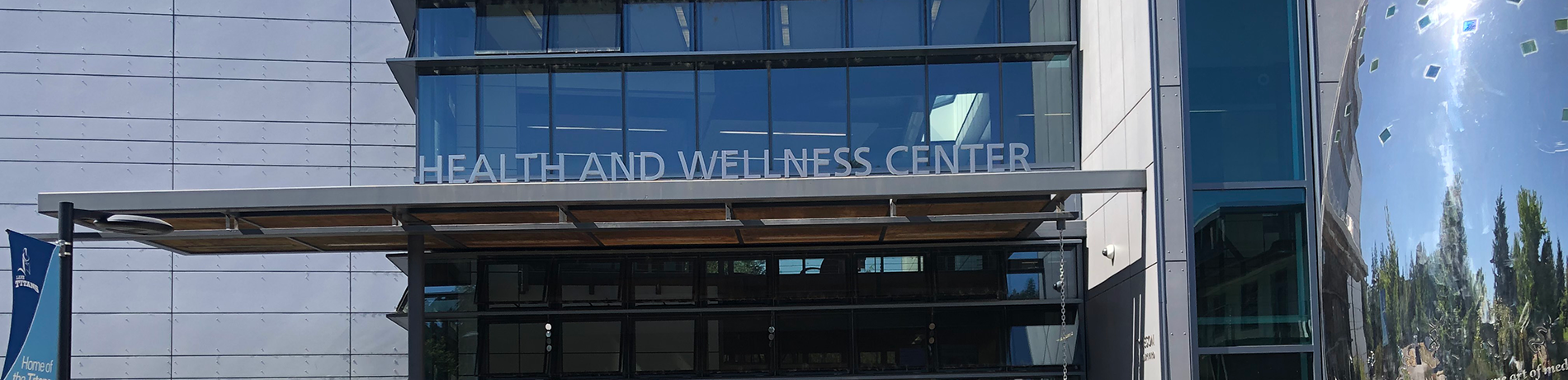 exterior of bldg 30 with sign reading "Health and Wellness Center"