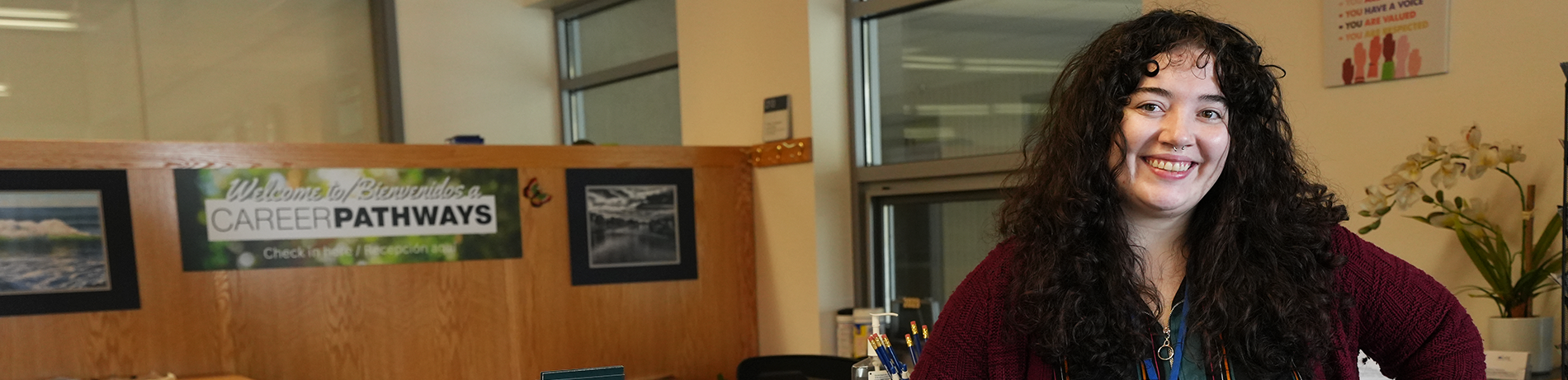 An advisor smiling in the career pathways office