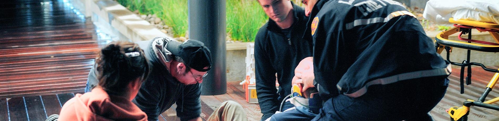 EMT students practicing treatment techniques