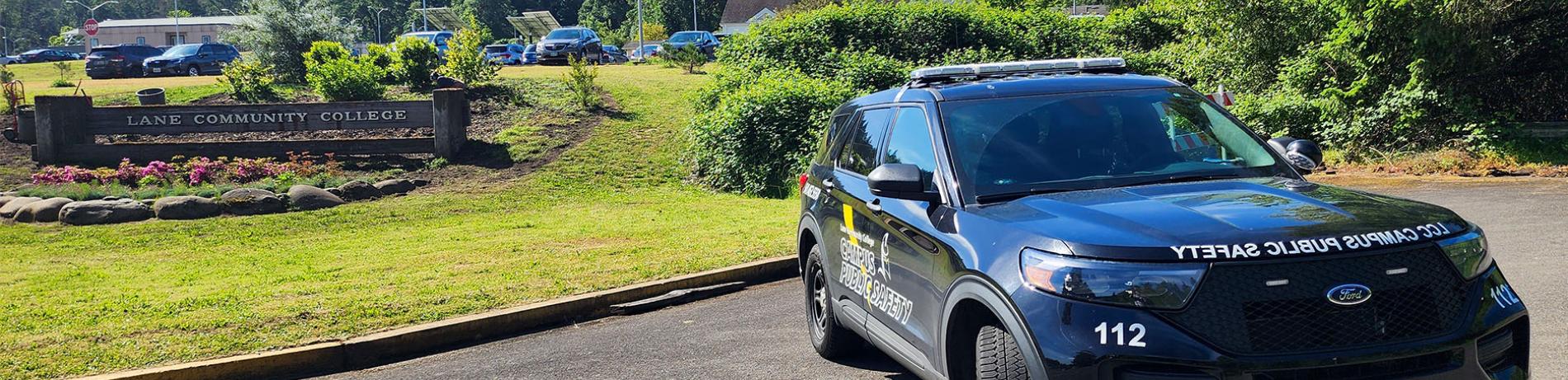 a Public safety vehicle parked in front of the LCC sign