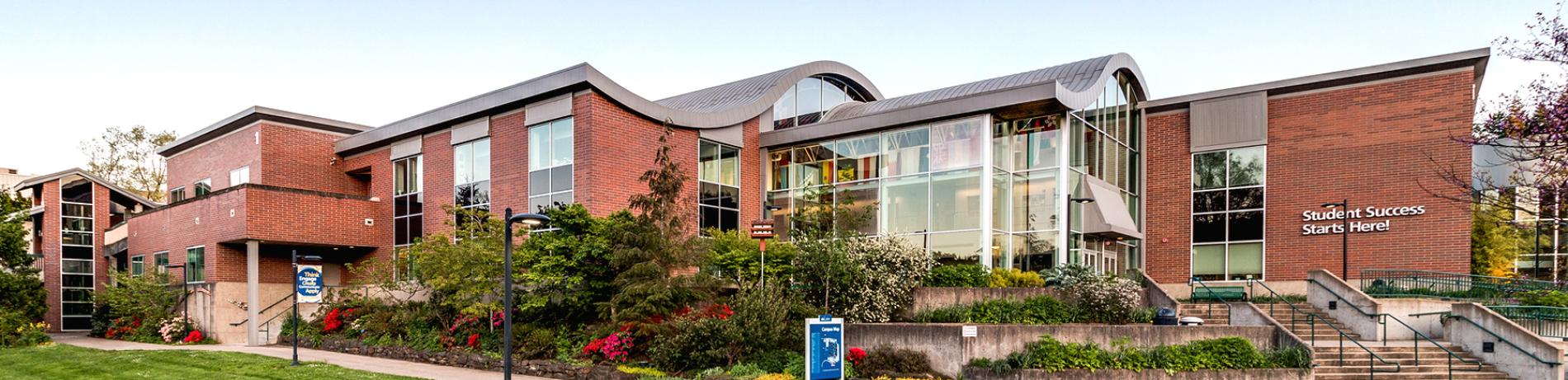 Brick building at LCC with the words "Student Success Starts Here" on the side