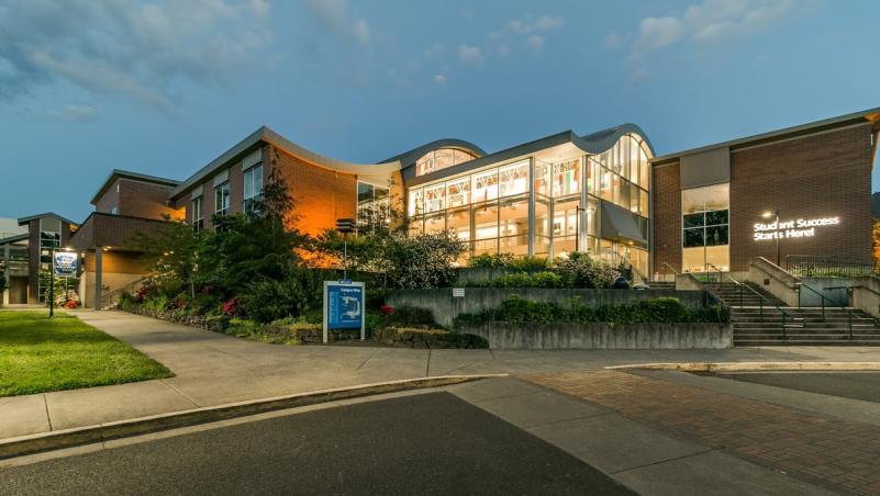 Building 1, LCC main campus, lit up in the early morning before sunrise