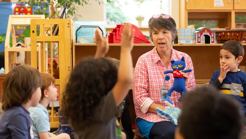 Childcare provider with a stuffed animal