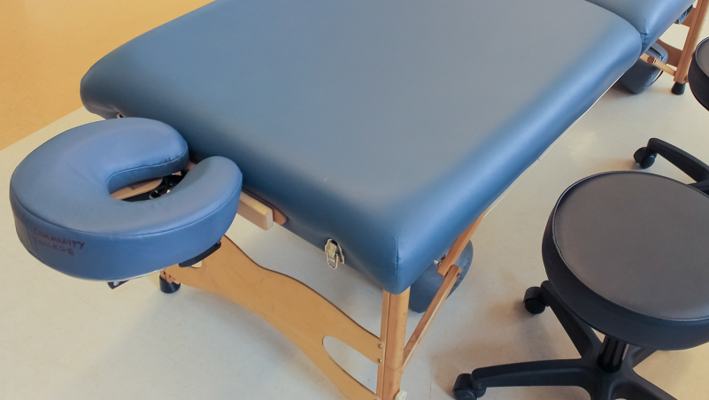 massage table and a stool