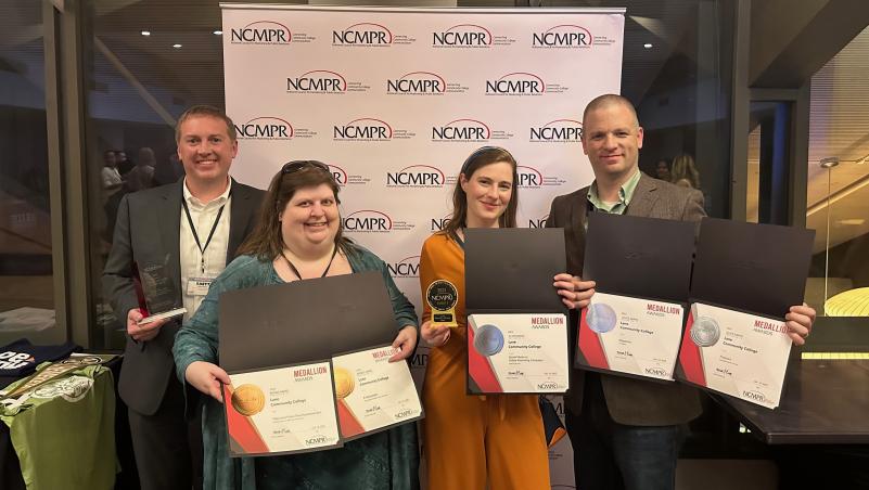 The Lane marketing team holding awards