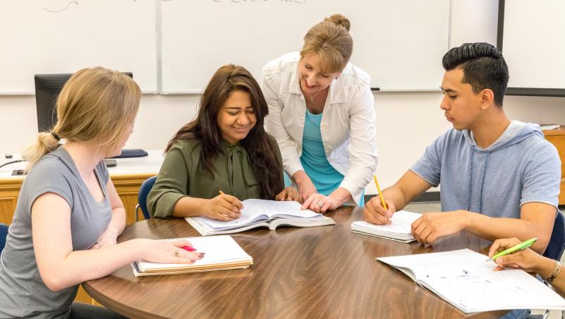 an instructor teaching business students about diverse communication